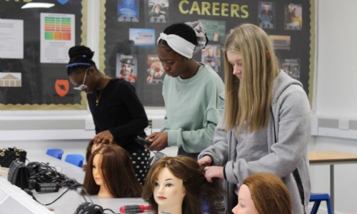 Year 9 students taking part in Hairdressing activity.